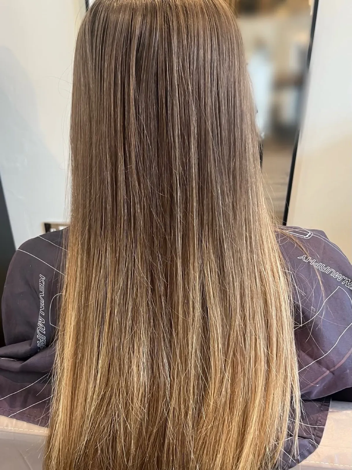 Rear view before: flat straight light-brown hair with soft golden ends.