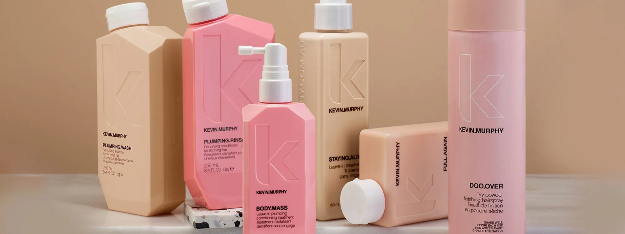 Kevin Murphy Plumping and Body Mass range for thinning hair, in blush tones.